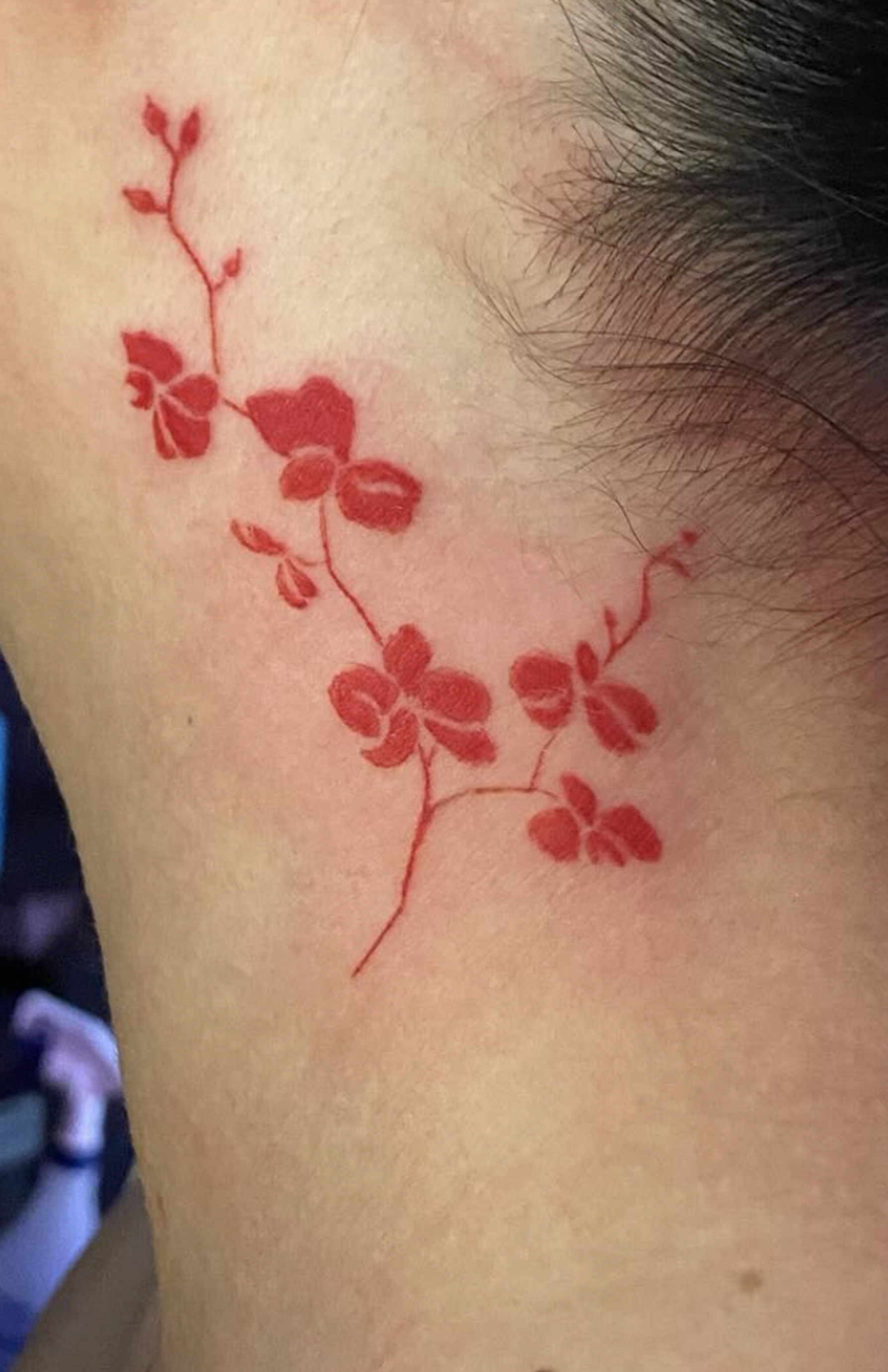 red flower tattoo